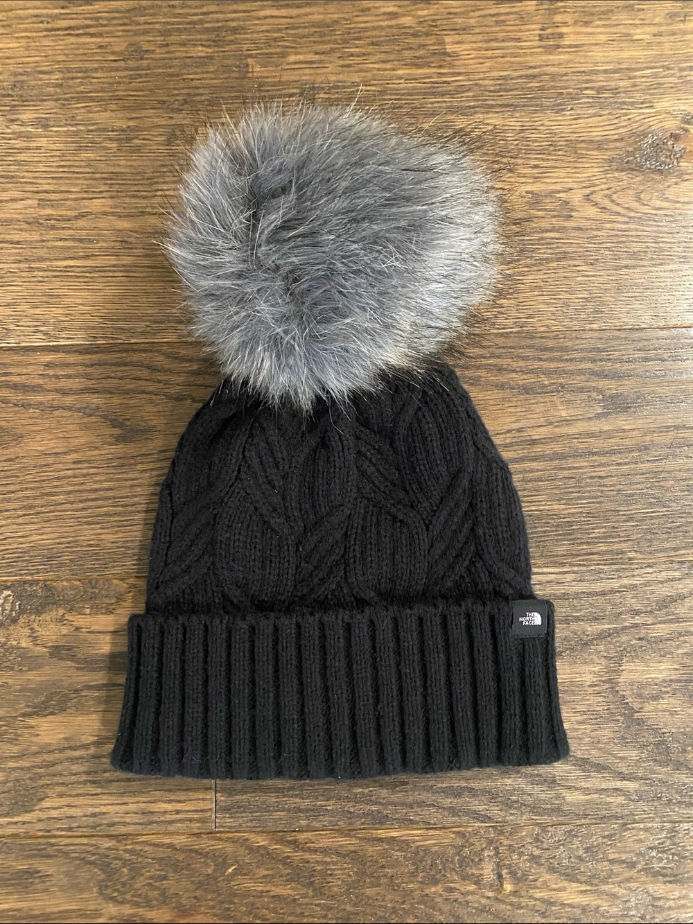 The North Face Black Knit Beanie with Gray Faux Fur Pom
